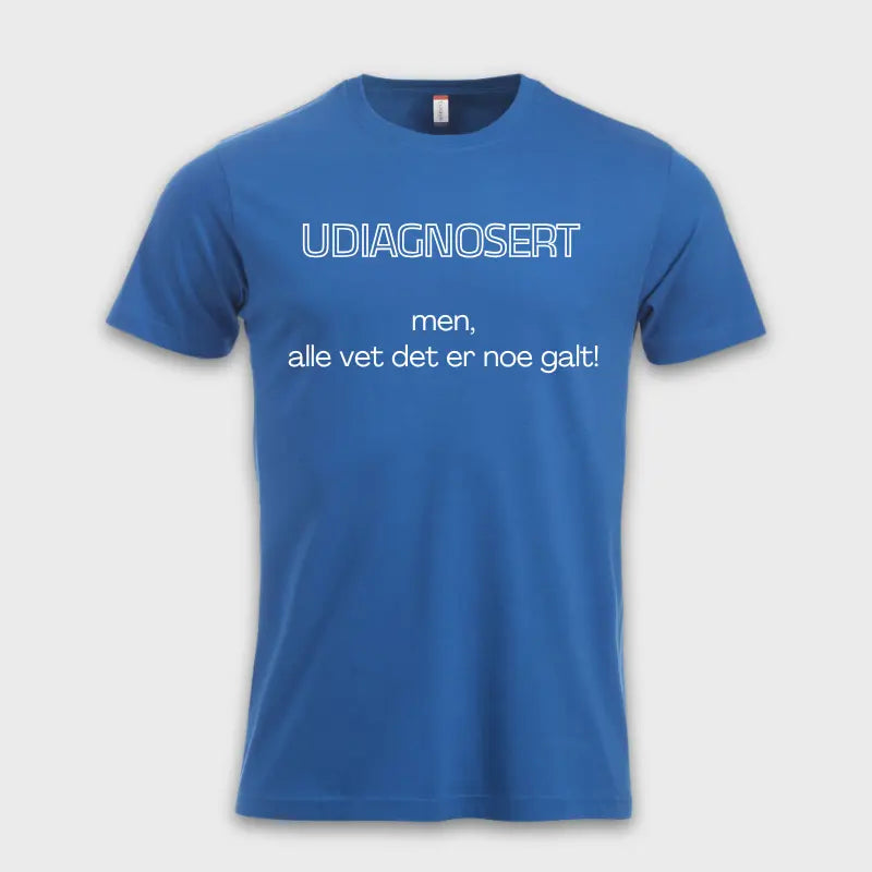 Blue T-shirt with the text 'UNDIAGNOSED – but everyone knows something is wrong!' printed on the front
